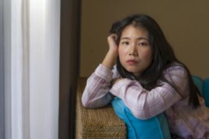 a woman works through issues in a bipolar disorder treatment center