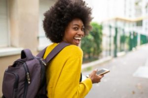 a woman is happy to learn about rehab insurance providers