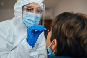 a doctor and a patient represent the covid-19 response